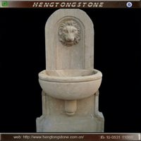 Fontaine murale en marbre naturel chinois sculptée en forme de tête de lion