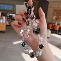 Élégant cordon de téléphone perlé en forme de losange, bracelet à perles de cristal, pendentif, bracelet de poignet style Instagram, lanière anti-perte pour téléphone