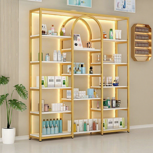 Expositor de Cosméticos Metálico Dorado Popular 2026 para Salón de Belleza, Estante de Almacenamiento de Múltiples Niveles con Gabinete y Logotipo de Marca Personalizado - Product Image 1