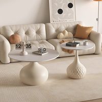 Table basse design en métal et pierre pour petit appartement, combinaison créative pour salon, table d'appoint noire haut de gamme pour canapé