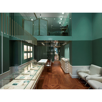 Vitrine murale à LED rétroéclairée avec motif géométrique moderne en forme de diamant et dessus en verre pour boutique