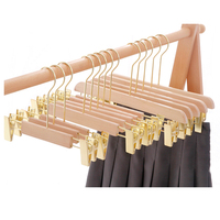 Cintre en bois personnalisé Oem et ODM, logo imprimé avec rose doré