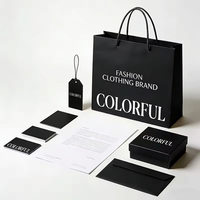 Conjunto de Empaque de Lujo Personalizado para Ropa: Bolsa de Compras de Papel Negro Mate Premium, Caja de Regalo para Prendas y Etiqueta Colgante Personalizada