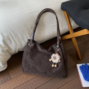 Brownish-<b>yellow</b> suede shoulder <b>bag</b> with a sweet, plush charm; women's handbag. - Product Image 3