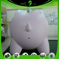Pig gonflable personnalisé en PVC/tissu Oxford avec ventilateur intégré et décorations monétaires pour événements publicitaires