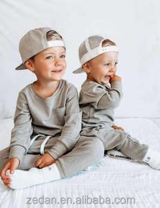 Kaos Bayi Grosir Bahan Waffle Polos Lengan Panjang Model Hem Melengkung dengan Saku - Product Image 5