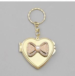Al por mayor: Llavero de aleación plateada ligero estilo vintage coreano para espejo, con colgante de lazo de perlas Y2K, para accesorios de bolsos de nicho - Product Image 3