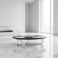 Table basse ronde en cristal artisanale de luxe moderne pour penthouse urbain, salon panoramique et salle VIP de restaurant de luxe