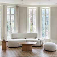 Canapé d'angle minimaliste de luxe trois places en tissu blanc, garni d'éponge, forme ovale, pour salon