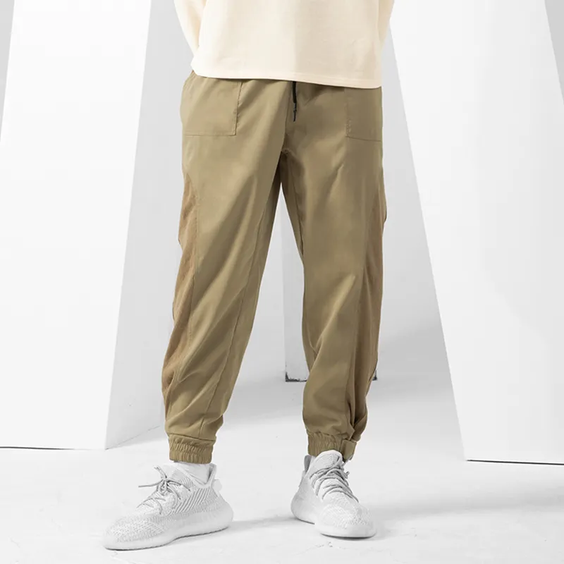 Pantaloni Jogger estivi da uomo pantaloni sportivi allentati Casual per uomo con vita regolabile e pantaloni per il tempo libero con apertura delle gambe