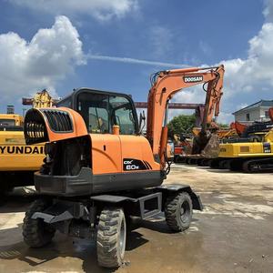 รถขุดล้อยาง Doosan DX60W มือสอง ขนาด 6 ตัน พร้อมเครื่องยนต์ เกียร์ และปั๊ม สำหรับงานก่อสร้างและงานถนน - Product Image 1