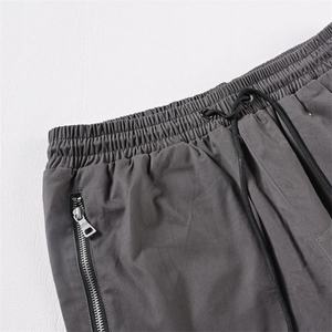กางเกงขายส่งคุณภาพสูงทรงขากระดิ่งสำหรับผู้ชาย เป็นมิตรกับสิ่งแวดล้อม ระบายอากาศได้ดี มีเชือกผูก ปรับขนาดได้ มีกระเป๋าหลายช่อง ทันสมัย - Product Image 3