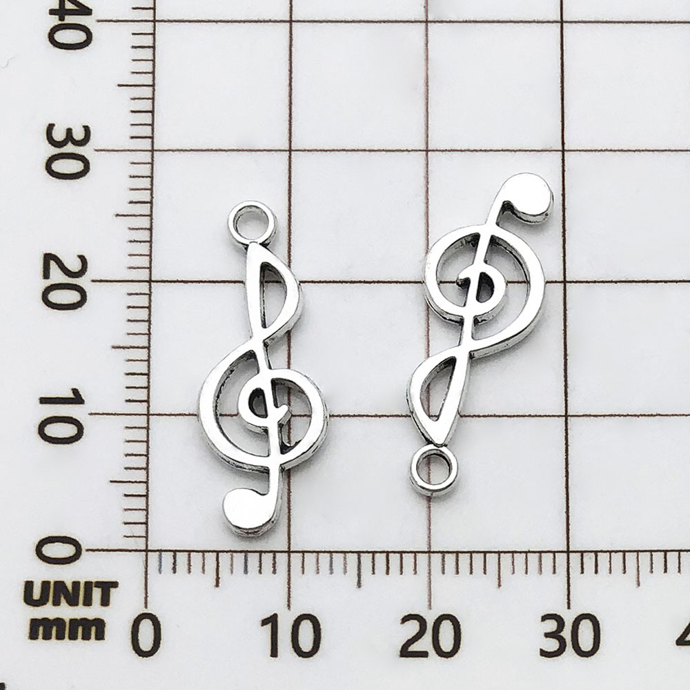 Une note de musique antique en argent - 0,8g - 10*25mm - 5619