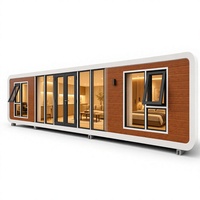 Villa mobile de luxe de 40 pieds en bois grainé, capsule spatiale, hôtel de villégiature, maison préfabriquée, mini-maison