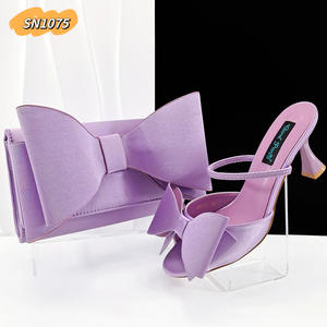 Set di Scarpe e Borsa <span class=keywords><strong>Viola</strong></span> Chiaro di Alta Qualità per Feste Nigeriane, <span class=keywords><strong>Sandali</strong></span> <span class=keywords><strong>con</strong></span> <span class=keywords><strong>Tacco</strong></span> Alto a Stiletto, Design <span class=keywords><strong>con</strong></span> Fiocco, Scarpe Opache - Product Image 1