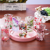 Vente en gros de tasses à café en verre à double paroi isolées, transparentes, résistantes à la chaleur, en borosilicate de haute qualité, avec fleurs séchées