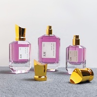 Bouteilles de parfum en verre épais de créateur Pulvérisateur à pompe à bouchon doré unique Emballage de parfum personnalisé 30ml 50ml 100ml Sérigraphie