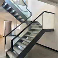 Escalier en colimaçon flottant élégant avec marches en marbre et design mono-équerre, finition poudrée, pour maison préfabriquée moderne intérieure