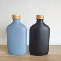 Vente en gros 100ml 200ml 250ml 350ml 500ml Flacon en verre noir avec couvercles à vis pour jus de fruits, café, liqueur, boisson, vin