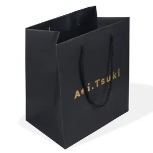 Sacchetto di carta nero boutique regalo di lusso di design personalizzato all'ingrosso con stampa logo