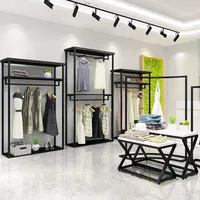 Özel siyah butik giyim mağazası ekran standı dekorasyon için Metal raf giyim konfeksiyon dükkanı