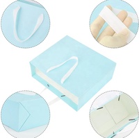 Sac cadeau de luxe pour femmes, vente en gros, vêtements de bonne qualité, sacs de transport en papier mat, sacs de shopping en carton avec poignée de ruban personnalisé