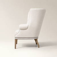 Fauteuil d'appoint moderne de luxe capitonné à dossier haut avec garniture cloutée et pieds en bois massif pour la maison et l'hôtellerie