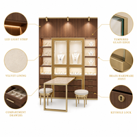 Vitrine à bijoux en marbre blanc sculpté doré, vitrine européenne en aluminium avec verre incurvé et éclairage LED, taille personnalisée pour boutique de détail