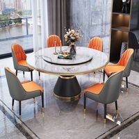 Ensemble de table à manger moderne en pierre frittée ronde avec plateau tournant et chaises rembourrées