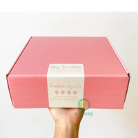 Boîtes d'expédition postales en carton ondulé personnalisées avec impression couleur de logo sur mesure pour emballages cosmétiques roses
