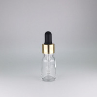 Flacon d'huile essentielle en verre givré vert de 10 ml avec logo personnalisé, estampage à chaud doré, compte-gouttes en aluminium doré 18/410