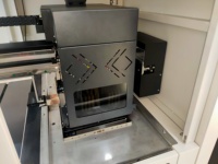 Imprimante DTG A4 double station avec 4 têtes I3200 pour l'impression directe sur vêtements en fibres naturelles et synthétiques (nylon)