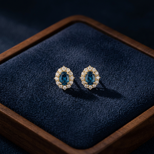 Boucles d'oreilles ovales en saphir bleu avec halo – Or 14 carats avec diamants certifiés – Fabricant de bijoux fins par Heerak Diamonds - Product Image 1