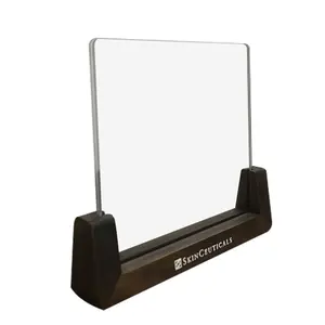 Transparent acrylic menu stand with a wooden counter top shelf, ideal for restaurants and hotels.