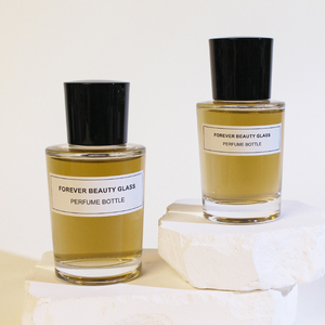 Flacon de parfum recyclable, nouveau design, cylindrique, vide, en verre ambré, avec <span class=keywords><strong>un</strong></span> grand bouchon noir. - Product Image 1