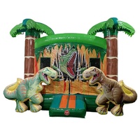 Château gonflable dinosaure jungle avec toboggan et aire de saut
