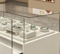 Comptoir de présentation de bijoux en verre blanc minimaliste moderne, vitrine de vente au détail verrouillable avec tiroirs de rangement