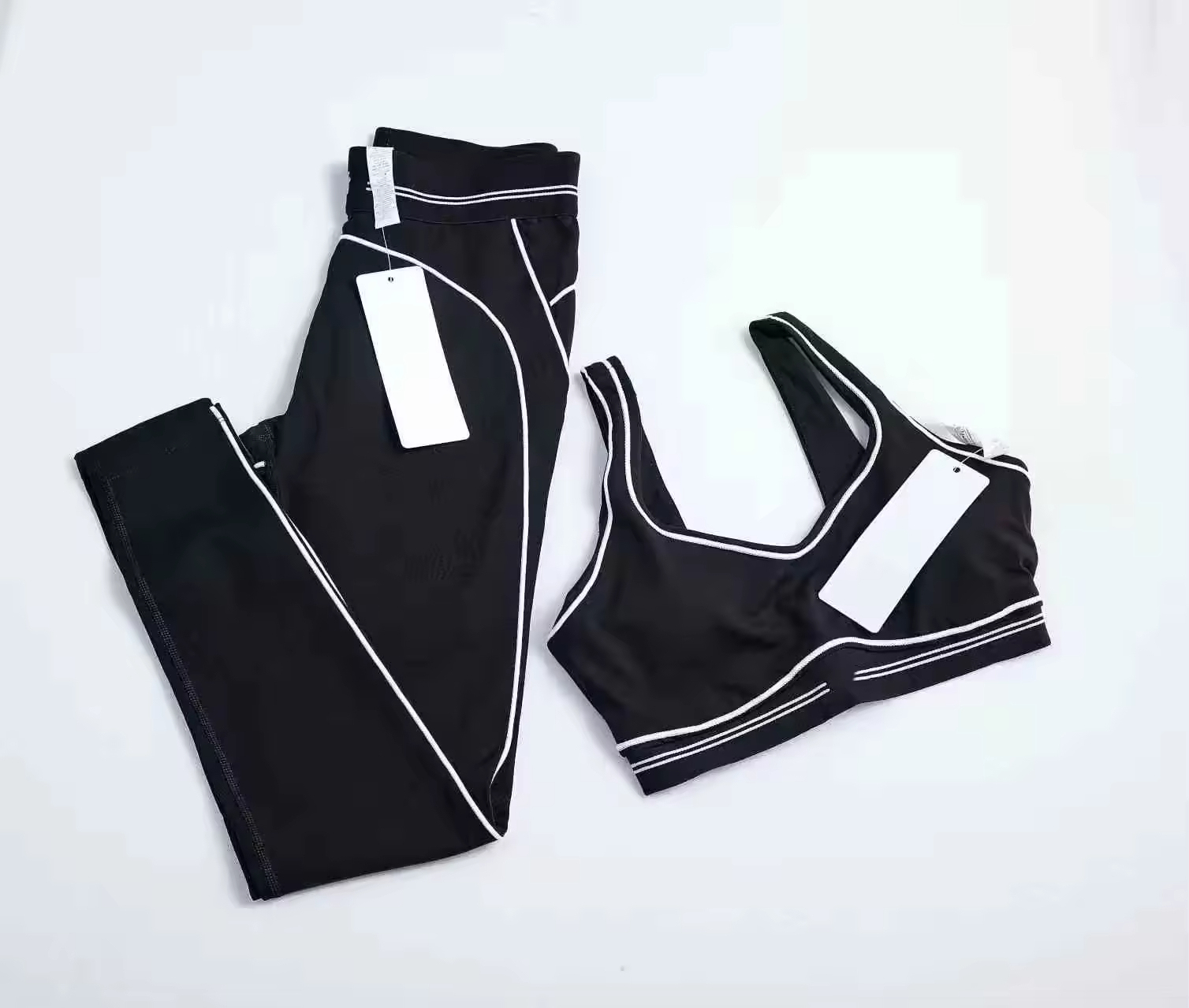 Wholesale Solid Breathable Fashion Yoga Pilates Stretch Seamless Ribbed High-quality Leggings 2 Piece Set Front Logo for Women