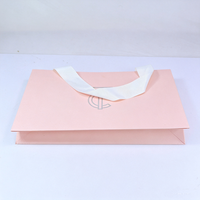 Fabricants de sacs en papier cosmétiques roses de luxe personnalisés avec logo imprimé pour emballages de shampooings et lotions, vente en gros