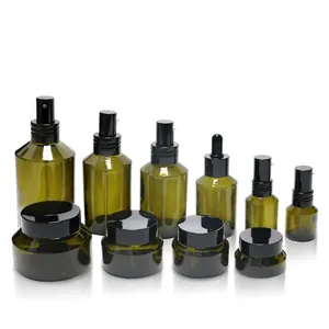 Transparent green skin care glass packaging 60ml 100ml 4 oz slant shoulder bottle with dropper pump spray cosmetic bottles jars