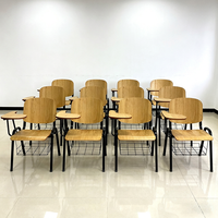 Chaise d'étudiant moderne monobloc avec tablette d'écriture pliable et pieds en métal robustes pour les petits espaces, les écoles et les bureaux
