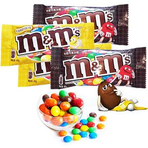 Chocolats en grains <span class=keywords><strong>M</strong></span>&<span class=keywords><strong>Ms</strong></span> au lait en gros à bas prix, bonbons au chocolat aux saveurs exotiques <span class=keywords><strong>et</strong></span> billes de chocolat (paquet de 40g) - Product Image 1