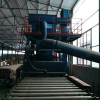 Machine de sablage à convoyeur à rouleaux continu pour le traitement de profilés en acier à haut volume