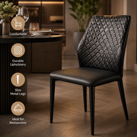 Chaises de salle à manger texturées à dossier fini en noir suie, avec pieds en métal élancés et coussin d'assise moelleux, pour café artisanal et restaurant de jardin