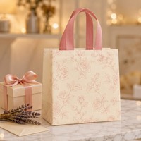 Sac cadeau non tissé en gros, écologique et réutilisable, imprimé floral avec poignées roses pour l'emballage de cadeaux de détail