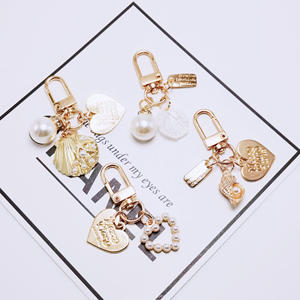 Mignon Perle Shell AirPods Pendentif Créatif Petit Porte-clés En Métal En Gros Ins Métal Bijoux Alliage Décapsuleur Idée Cadeau - Product Image 4