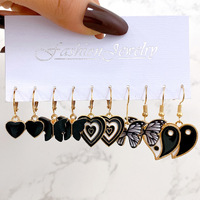 Vente en gros de boucles d'oreilles créatives avec pendentifs en forme de papillon noir, ensemble de boucles d'oreilles Tai Chi en forme de cœur, accessoires pour femmes