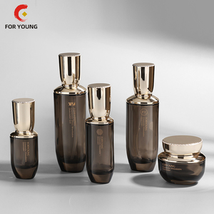 Chai Thủy Tinh Thiết Kế Mới Sang Trọng Bộ Bao Bì Chăm Sóc Da Rỗng Có Nắp Màu Vàng Chai Bơm Kem Dưỡng Da Lọ Kem Màu OEM - Product Image 1