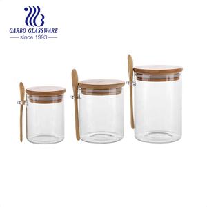 الجملة مخصص رخيصة مختومة اسطوانة الغذاء الحلوى حاويات مربع برطمانات تخزين زجاجية مع خشبية أعلى غطاء زجاجة حزمة - Product Image 6