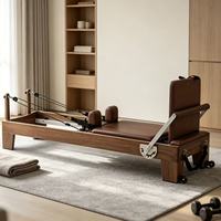 Ensemble de cinq pièces de Pilates en noyer massif : Cadillac, Reformer, Wunda Chair, Ladder Barrel, Spine Corrector